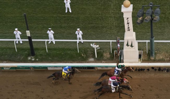 Brian Hernandez Jr. rides Mystik Dan, top right, to the finish line to win the 150th running of the Kentucky Derby horse race at Churchill Downs Saturday, May 4, 2024, in Louisville, Ky. (AP Photo/Charlie Riedel)
