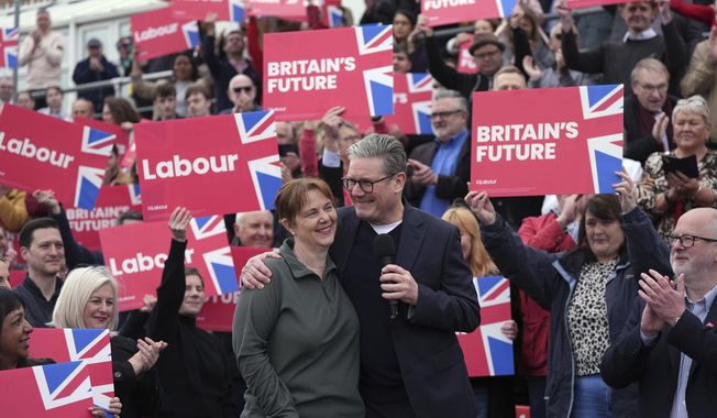 Britain&#x27;s Labour Party leader Sir Keir Starmer with newly elected East Midlands mayor Claire Ward during a visit to Forest Town Arena in Mansfield, England, Saturday May 4, 2024. (Jacob King/PA via AP)