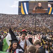 Rawan Antar, 21, center, chants in support of Palestinians during the University of Michigan&#x27;s Spring 2024 Commencement Ceremony at Michigan Stadium in Ann Arbor, Mich., on Saturday, May 4, 2024. (Katy Kildee/Detroit News via AP)