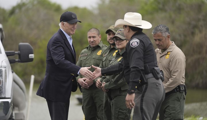 President Joe Biden talks with the U.S. Border Patrol and local officials, as he looks over the southern border, Feb. 29, 2024, in Brownsville, Texas, along the Rio Grande. (AP Photo/Evan Vucci, File)