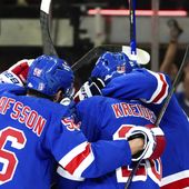 New York Rangers defenseman Erik Gustafsson (56), left wing Jimmy Vesey and others celebrate center Vincent Trocheck&#x27;s goal against the Carolina Hurricanes during the first period in Game 1 of an NHL hockey Stanley Cup second-round playoff series, Sunday, May 5, 2024, in New York. (AP Photo/Julia Nikhinson)