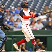 Washington Nationals&#x27; Eddie Rosario, right, watches with Toronto Blue Jays catcher Alejandro Kirk his two run go-ahead home run to right center field during the seventh inning of a baseball game, Sunday, May 5, 2024, in Washington. (AP Photo/John McDonnell)