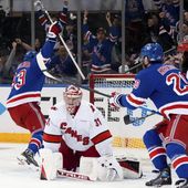 Carolina Hurricanes goaltender Frederik Andersen (31) looks on as New York Rangers center Mika Zibanejad and left wing Chris Kreider celebrate following Zibanejad&#x27;s goal during the first period in Game 1 of an NHL hockey Stanley Cup second-round playoff series, Sunday, May 5, 2024, in New York. (AP Photo/Julia Nikhinson)