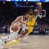 New York Knicks&#x27; Jalen Brunson (11) drives past Indiana Pacers&#x27; Aaron Nesmith (23) during the first half of Game 1 in an NBA basketball second-round playoff series, Monday, May 6, 2024, in New York. (AP Photo/Frank Franklin II)