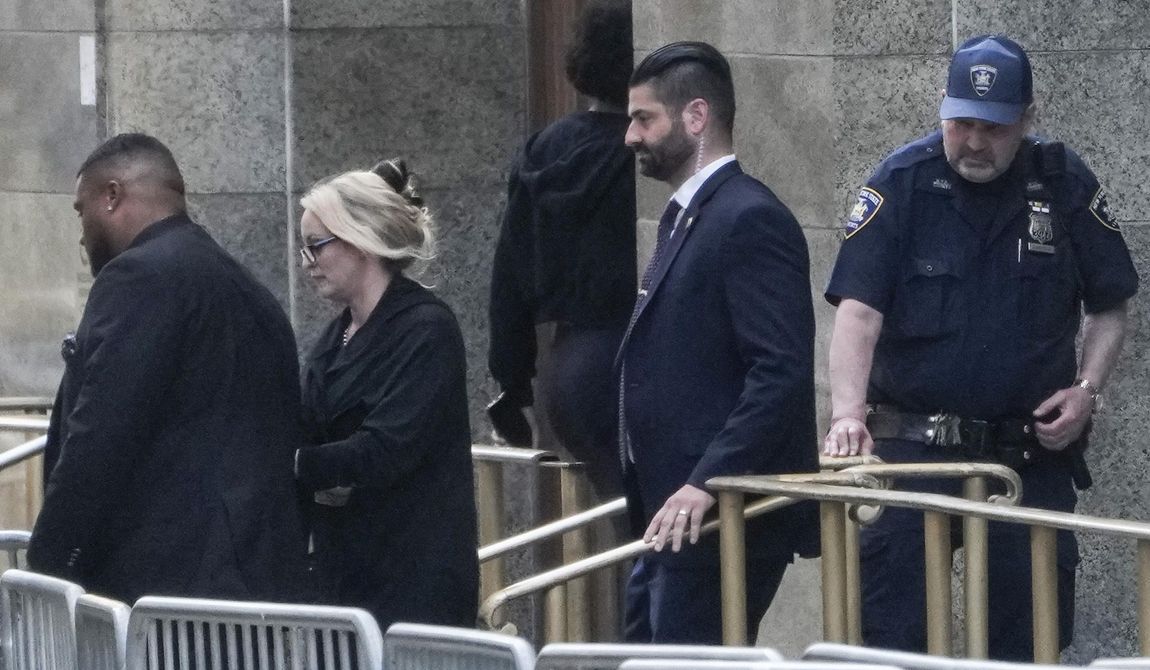 Stormy Daniels, second from left, exits the courthouse in New York, Tuesday, May 7, 2024. Porn actor Daniels, whose real name is Stephanie Clifford, took the stand mid-morning Tuesday and testified about her alleged sexual encounter with Trump in 2006, among other things. (AP Photo/Seth Wenig) **FILE**