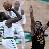 Boston Celtics guard Jaylen Brown (7) shoots as Cleveland Cavaliers&#x27; Donovan Mitchell defends during the first half of Game 1 of an NBA basketball second-round playoff series Tuesday, May 7, 2024, in Boston. (AP Photo/Charles Krupa)