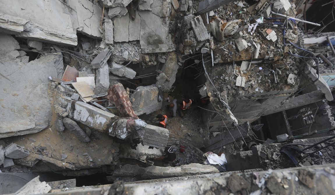 Palestinians look at the destruction after an Israeli strike on residential building in Rafah, Gaza Strip, Tuesday, May 7, 2024. (AP Photo/Ismael Abu Dayyah)