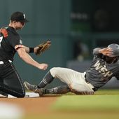Washington Nationals outfielder Eddie Rosario, right, steals second base from Baltimore Orioles second baseman Jordan Westburg, left, during the seventh inning of a baseball game at Nationals Park in Washington, Tuesday, May 7, 2024. (AP Photo/Susan Walsh)
