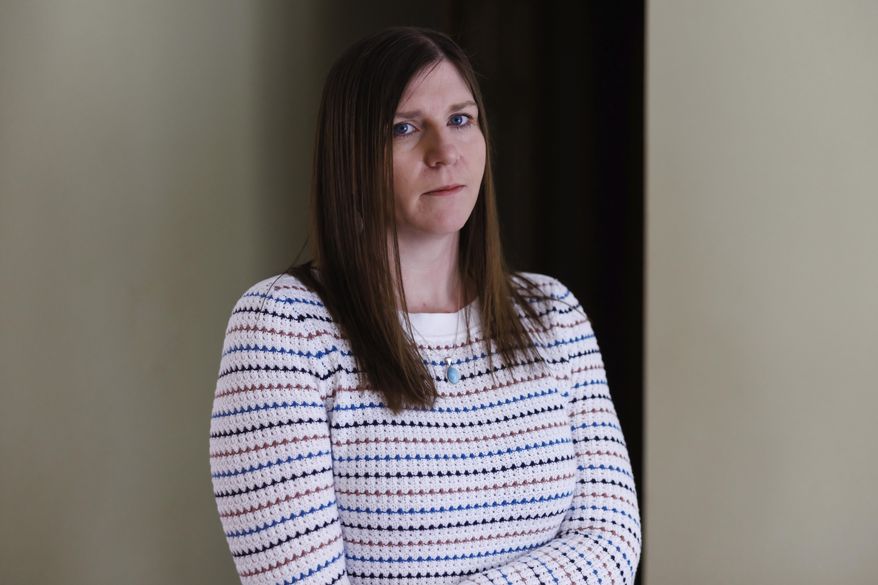 FILE - In this photograph provided by Stephen Davis Phillips/Goldwater Institute, Amber Lavigne, of Newcastle, Maine, poses on March 25, 2023, at her home in Newcastle. A federal judge dismissed a lawsuit brought by the Maine woman who accused school officials of encouraging her teen’s gender expression by providing a chest binder and using a new name and pronouns, without consulting parents. (Stephen Davis Phillips/Goldwater Institute via AP)