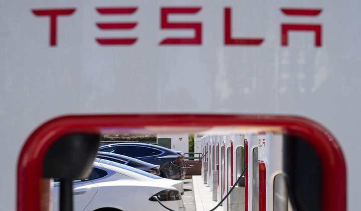 Tesla vehicles charge at a station in Emeryville, Calif., Aug. 10, 2022. (AP Photo/Godofredo A. Vásquez, File)