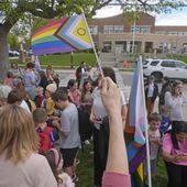 Bonneville Elementary School parents and students gather during a block party supporting trans and non binary students and staff on April 29, 2024, in Salt Lake City. Transgender activists have flooded a Utah tip line created to alert state officials to possible violations of a new bathroom law with thousands of hoax reports in an effort to shield trans residents and their allies from any legitimate complaints that could threaten their safety. (AP Photo/Rick Bowmer, File)