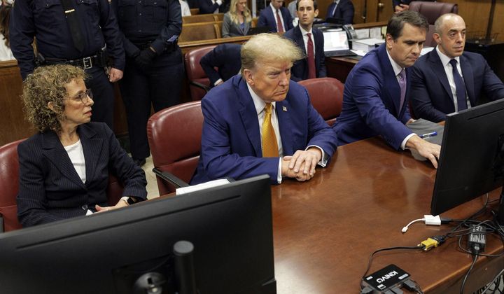 Former President Donald Trump, center, sits at the defense table with his attorneys Susan Necheles, from left, Todd Blanche and Emil Bove, in Manhattan criminal court, Tuesday, May 7, 2024, in New York. (Sarah Yenesel/Pool Photo via AP)