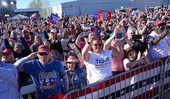 Supporters react as Republican presidential candidate former President Donald Trump speaks at a campaign rally in Freeland, Mich., Wednesday, May 1, 2024. (AP Photo/Paul Sancya)