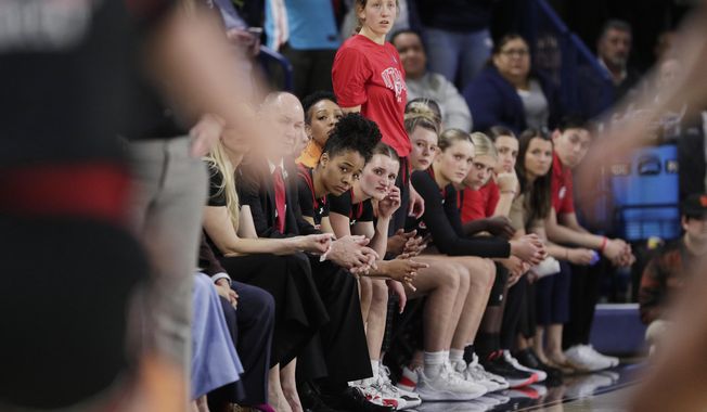 Players and staff on the Utah bench react toward the end of a second-round college basketball game against Gonzaga in the NCAA Tournament in Spokane, Wash., Monday, March 25, 2024. A northern Idaho prosecutor won&#x27;t bring hate crime charges against an 18-year-old accused of shouting a racial slur at members of the Utah women&#x27;s basketball team while the team was in Idaho to attend the NCAA Tournament. (AP Photo/Young Kwak, File)