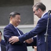 Chinese President Xi Jinping, left, shakes hands with his Serbian counterpart Aleksandar Vucic greet the crowd at the Serbia Palace in Belgrade, Serbia, Wednesday, May 8, 2024. (AP Photo/Darko Bandic)