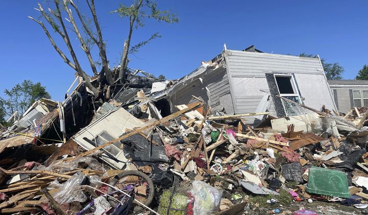 A storm damaged mobile home is surrounded by debris at Pavilion Estates mobile home park just east of Kalamazoo, Mich. Wednesday, May 8, 2024. A tornado ripped through the area the evening of May 7. (AP Photo/Joey Cappelletti)