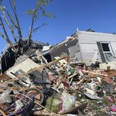 A storm damaged mobile home is surrounded by debris at Pavilion Estates mobile home park just east of Kalamazoo, Mich. Wednesday, May 8, 2024. A tornado ripped through the area the evening of May 7. (AP Photo/Joey Cappelletti)