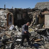 A gas worker inspects a ruined private house after a Russian missile attack in Kyiv region, Ukraine, Wednesday, May 8, 2024. (AP Photo/Efrem Lukatsky)