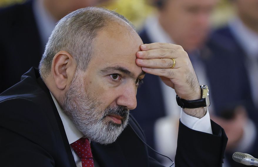 Armenian Prime Minister Nikol Pashinyan attends a meeting of the Supreme Eurasian Economic Council of the Eurasian Economic Union at the Kremlin in Moscow, Russia, on Wednesday, May 8, 2024. Thousands of protesters gathered Thursday, May 9, 2024, in the Armenian capital, Yerevan, to demand the resignation of Prime Minister Nikol Pashinyan over his government's decision to hand over control of border villages to Armenia's long-time rival Azerbaijan. (Evgenia Novozhenina/Pool Photo via AP, File)