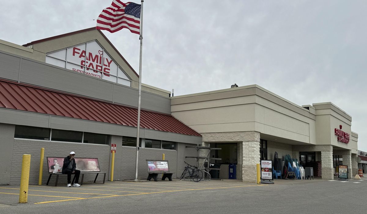 NextImg:Woman was living inside rooftop grocery store sign with computer and coffee maker for a year