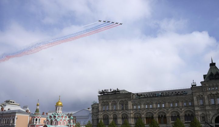 Russian Air Force Su-25 jets fly over Red Square leaving trails of smoke in colours of the national flag during the Victory Day military parade in Moscow, Russia, Thursday, May 9, 2024, marking the 79th anniversary of the end of World War II. (AP Photo/Alexander Zemlianichenko)
