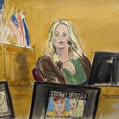 Stormy Daniels testifies on the witness stand as a promotional image for one of her shows featuring an image of Trump is displayed on monitors in Manhattan criminal court, Thursday, May 9, 2024, in New York. (Elizabeth Williams via AP)