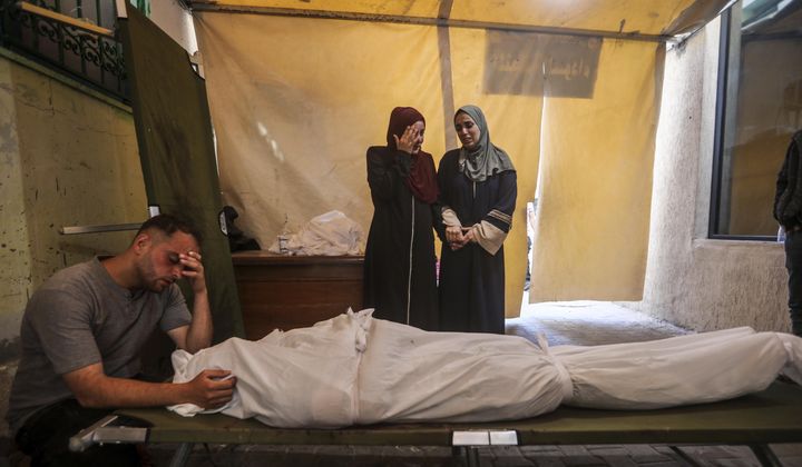 Palestinians mourn their relatives killed in the Israeli bombardment of the Gaza Strip, at a hospital in Rafah, Gaza, Friday, May 10, 2024. (AP Photo/Ismael Abu Dayyah)