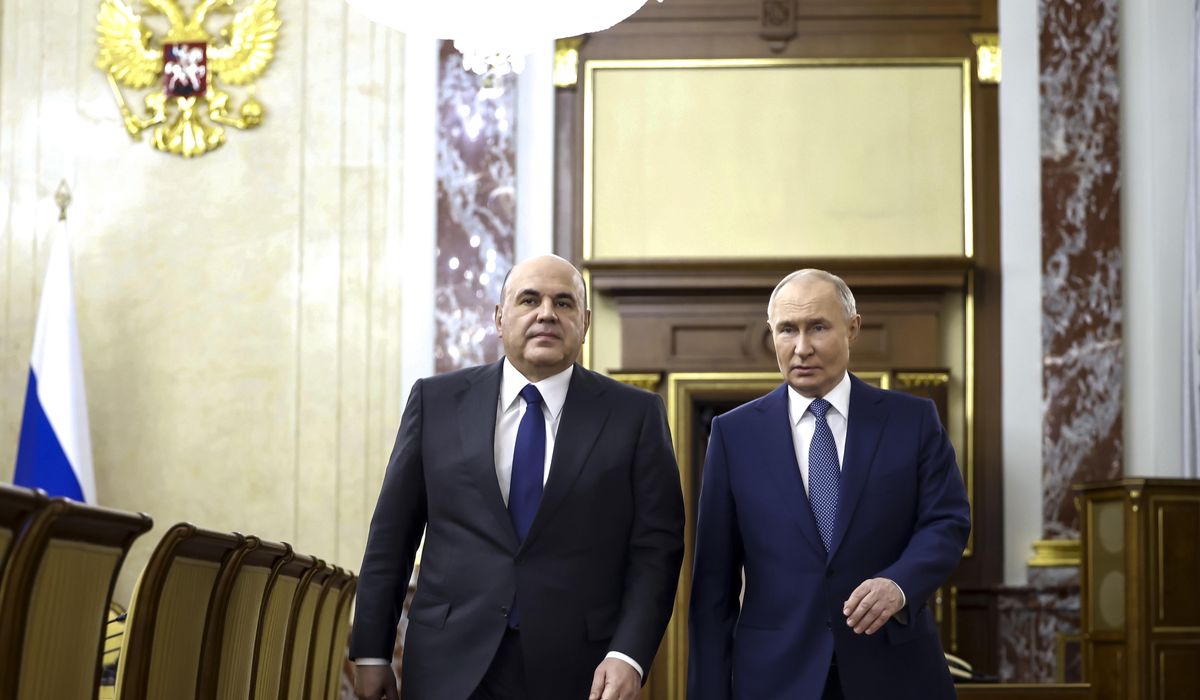 NextImg:Putin reappoints his prime minister, a technocrat who has kept a low political profile