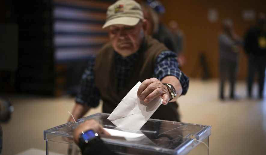 An early voter casts his ballot for Catalonia's regional elections in La Roca del Vallès, north of Barcelona, Sunday May 12, 2024. About 6 million Catalans are casting ballots in a regional election that will test if Catalonia wants pro-independence leader Carles Puigdemont back or if the wealthy region has moved on to more pressing worries. (AP Photo/Emilio Morenatti)