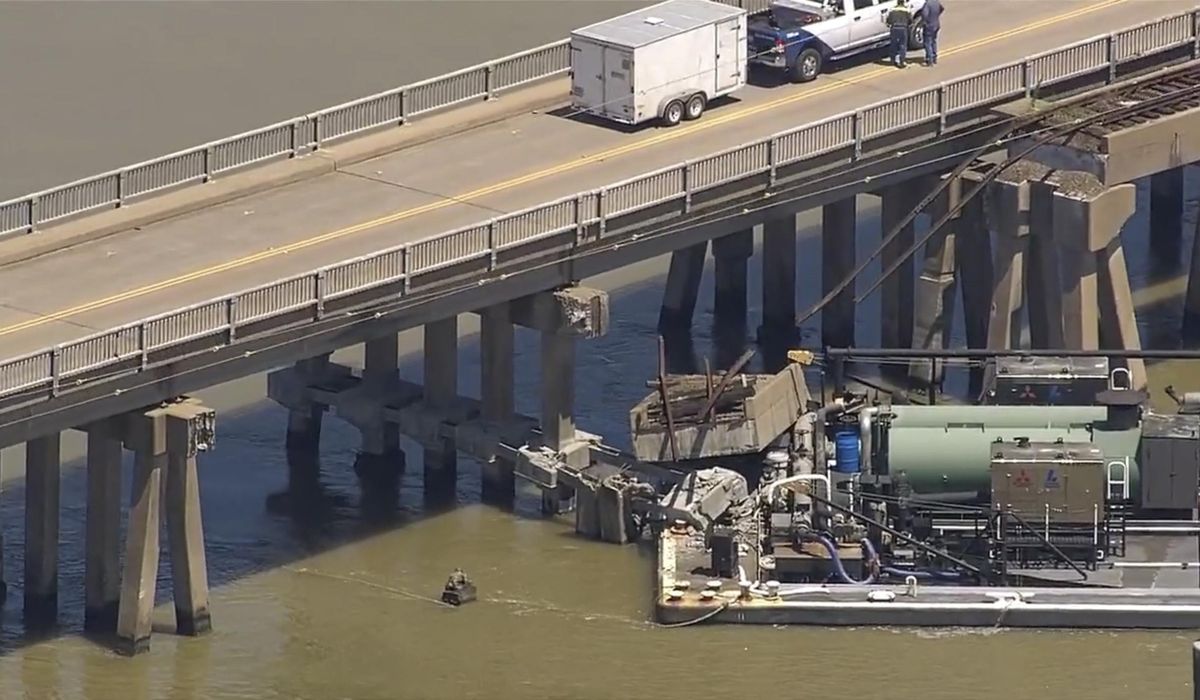 NextImg:Barge collision damages bridge between Galveston, Texas, and offshore island