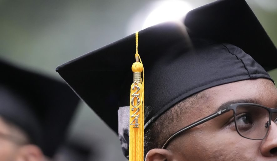 A tassel hangs from a mortarboard as graduating students arrive at the Morehouse College commencement before President Joe Biden speaks, Sunday, May 19, 2024, in Atlanta. (AP Photo/Alex Brandon)