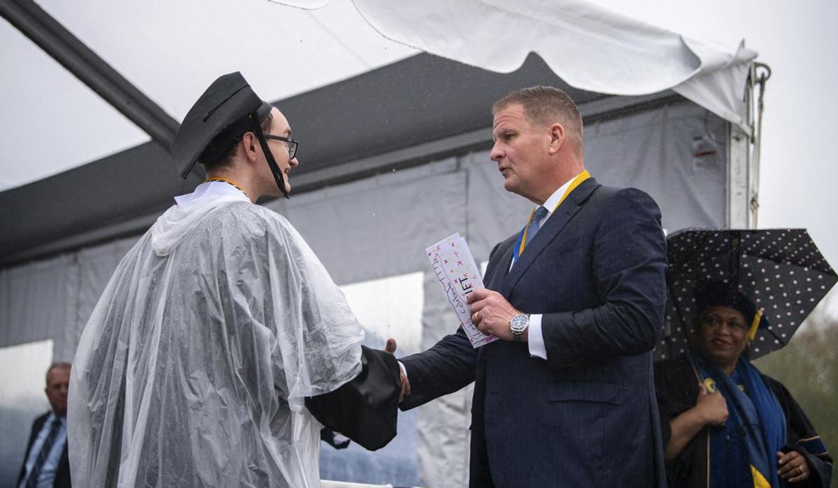 NextImg:Billionaire rains cash on UMass-Dartmouth grads to tune of $1K each, says they must give half away