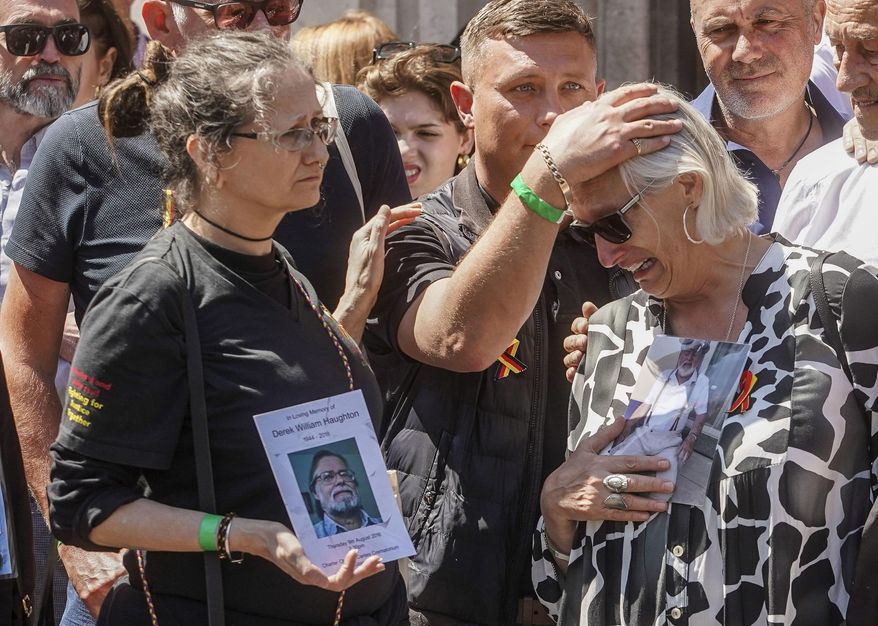 Cressida Haughton, left, who's father Derek and Deborah Dennis who's father Dennis died, react outside Central Hall in Westminster in London, after the publication of the Infected Blood Inquiry report, Monday May 20, 2024. British authorities and the country's public health service knowingly exposed tens of thousands of patients to deadly infections through contaminated blood and blood products, and hid the truth about the disaster for decades, an inquiry into the U.K.’s infected blood scandal found Monday. (Jeff Moore/PA via AP)