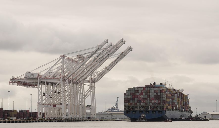 Tugboats escort the cargo ship Dali after it was refloated in Baltimore, Monday, May 20, 2024. The vessel on March 26 struck the Francis Scott Key Bridge causing it to collapse and resulting in the death of six people. (AP Photo/Matt Rourke)
