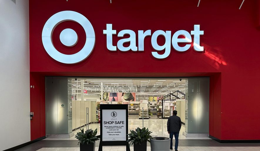 A shopper heads into a Target store on Jan. 11, 2024, in Lakewood, Colo. (AP Photo/David Zalubowski, File)