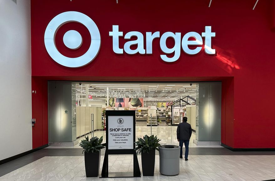 A shopper heads into a Target store on Jan. 11, 2024, in Lakewood, Colo. (AP Photo/David Zalubowski, File)