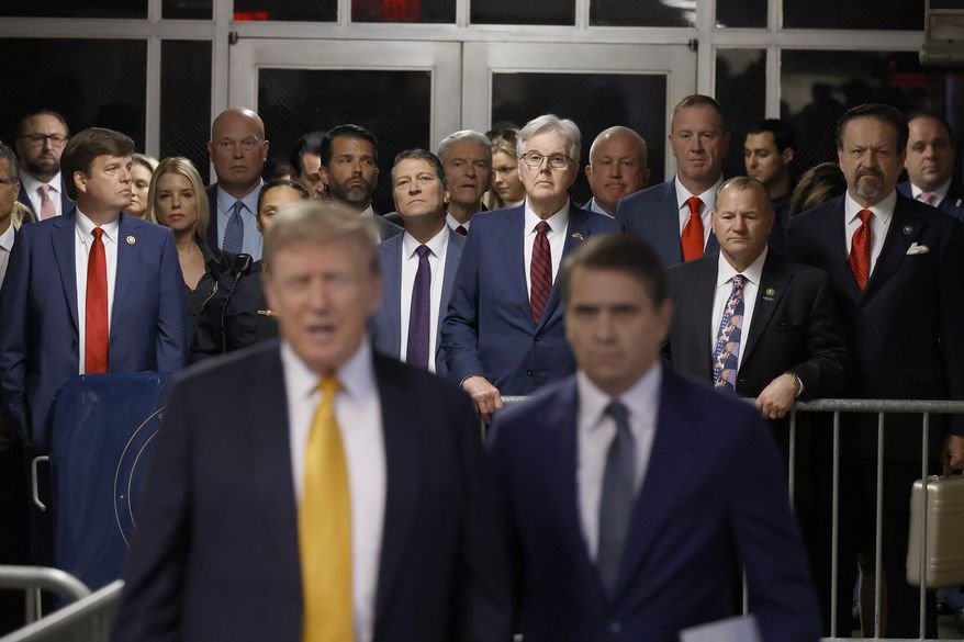 Supporters, family, and court officers watch as former President Donald Trump speaks to media before his trial at the Manhattan criminal court, Tuesday, May 21, 2024, in New York. (Michael M. Santiago/Pool Photo via AP)