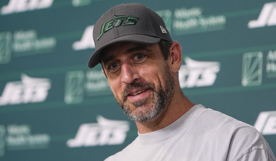 New York Jets quarterback Aaron Rodgers talks to reporters after a practice at the NFL football team's training facility in Florham Park, N.J., Tuesday, May 21, 2024. (AP Photo/Seth Wenig)