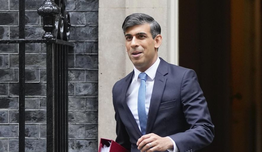 Britain's Prime Minister Rishi Sunak leaves 10 Downing Street to go to the House of Commons for his weekly Prime Minister's Questions in London, Wednesday, May 22, 2024. (AP Photo/Kin Cheung)