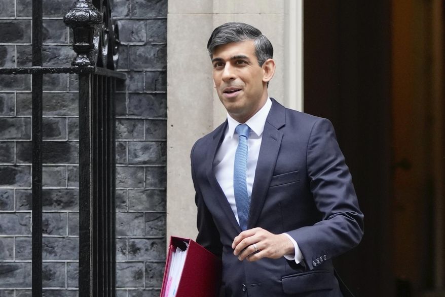 Britain's Prime Minister Rishi Sunak leaves 10 Downing Street to go to the House of Commons for his weekly Prime Minister's Questions in London, Wednesday, May 22, 2024. (AP Photo/Kin Cheung)