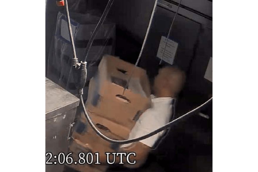 This image from video obtained by the Justice Department and included as part of an exhibit in a motion filed by the defense team to suppress boxes of records seized at Mar-a-Lago, shows Walt Nauta, personal aide to former President Donald Trump, carrying boxes at the Palm Beach, Fla., estate. (Justice Department via AP)