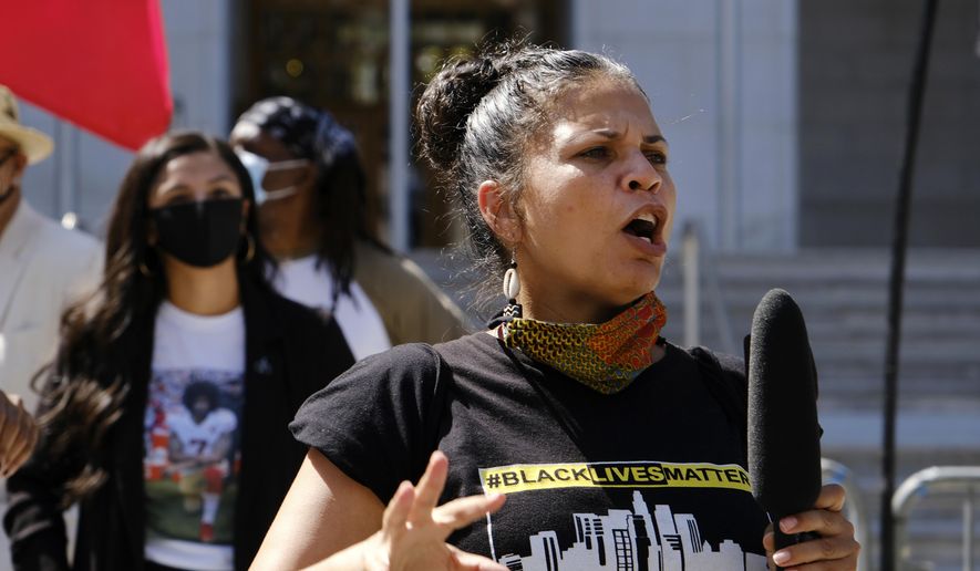 In this Aug. 5, 2020 file photo, Melina Abdullah speaks during a Black Lives Matter protest at the Hall of Justice in downtown Los Angeles. Abdullah on Thursday, May 23, 2024, lost her lawsuit against the city's police department over its handling of hoax calls that brought a large law enforcement response to her home four years ago. (AP Photo/Richard Vogel, File)