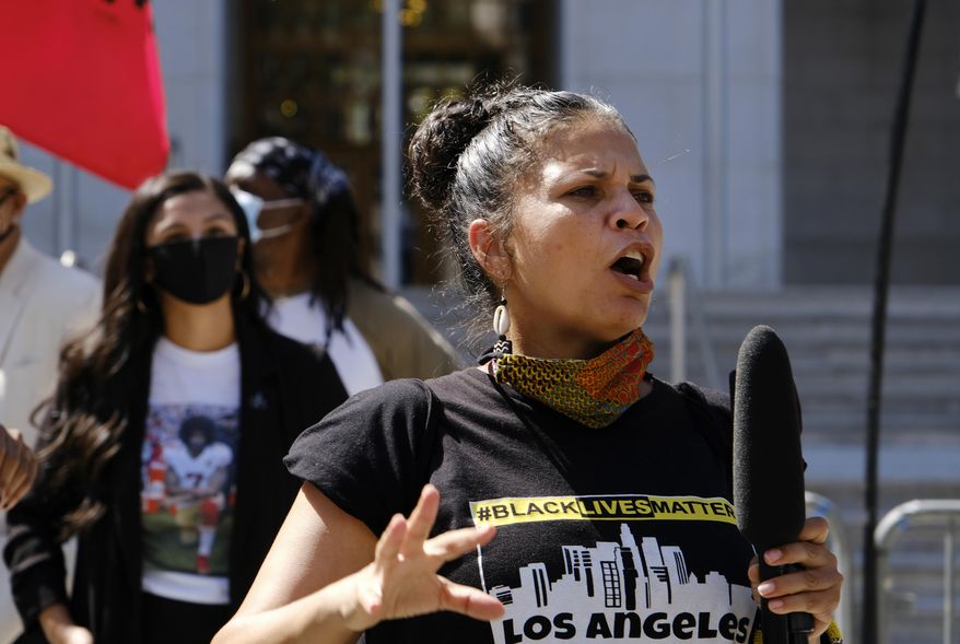 In this Aug. 5, 2020 file photo, Melina Abdullah speaks during a Black Lives Matter protest at the Hall of Justice in downtown Los Angeles. Abdullah on Thursday, May 23, 2024, lost her lawsuit against the city's police department over its handling of hoax calls that brought a large law enforcement response to her home four years ago. (AP Photo/Richard Vogel, File)