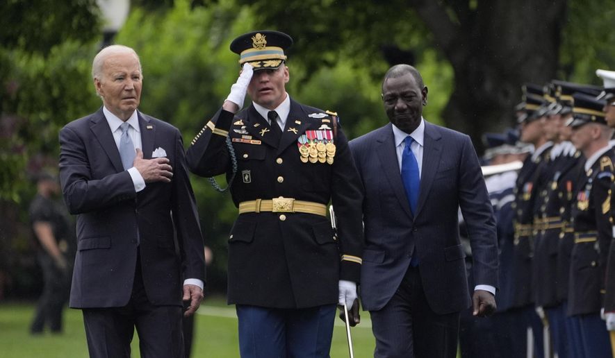President Joe Biden and Kenya's President William Ruto review the troops with Col. David Rowland, commander of the 3rd U.S. Infantry Regiment, The Old Guard, during a State Arrival Ceremony on the South Lawn of the White House in Washington, Thursday, May 23. 2024. (AP Photo/Evan Vucci)