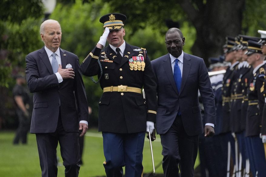 President Joe Biden and Kenya's President William Ruto review the troops with Col. David Rowland, commander of the 3rd U.S. Infantry Regiment, The Old Guard, during a State Arrival Ceremony on the South Lawn of the White House in Washington, Thursday, May 23. 2024. (AP Photo/Evan Vucci)