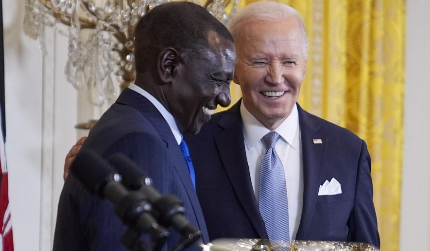 President Joe Biden shakes hands with Kenya's President William Ruto at the end of a news conference in the East Room of the White House, Thursday, May 23, 2024, in Washington. (AP Photo/Evan Vucci)