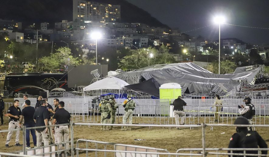 Security forces stand around a stage that collapsed due to a gust of wind during an event attended by presidential candidate Jorge Álvarez Máynez in San Pedro Garza García, on the outskirts of Monterey, Mexico, Wednesday, May 22, 2024. President Andres Manuel Lopez Obrador confirmed that multiple people were killed and at least a dozen were injured. (AP Photo/Alberto Lopez)