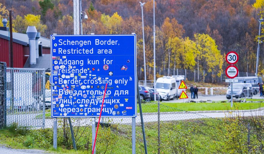 A sign indicating the Storskog border crossing between Russia and Norway is pictured near Kirkenes, Norway, on Sept. 28, 2022. Norway on Thursday, May 23, 2024, said it would further tighten entry rules from Russia, saying those with tourist visas issued by Norway before regulations were strengthened in spring 2022 or issued by another European country, will be barred from entering the Scandinavian country as of next week. (Lise Aserud/NTB Scanpix via AP, File)