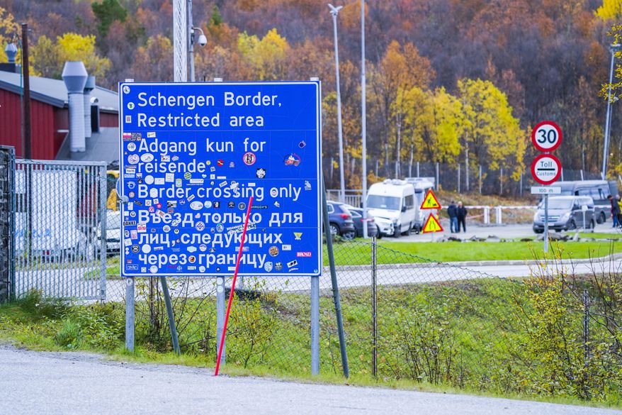 A sign indicating the Storskog border crossing between Russia and Norway is pictured near Kirkenes, Norway, on Sept. 28, 2022. Norway on Thursday, May 23, 2024, said it would further tighten entry rules from Russia, saying those with tourist visas issued by Norway before regulations were strengthened in spring 2022 or issued by another European country, will be barred from entering the Scandinavian country as of next week. (Lise Aserud/NTB Scanpix via AP, File)