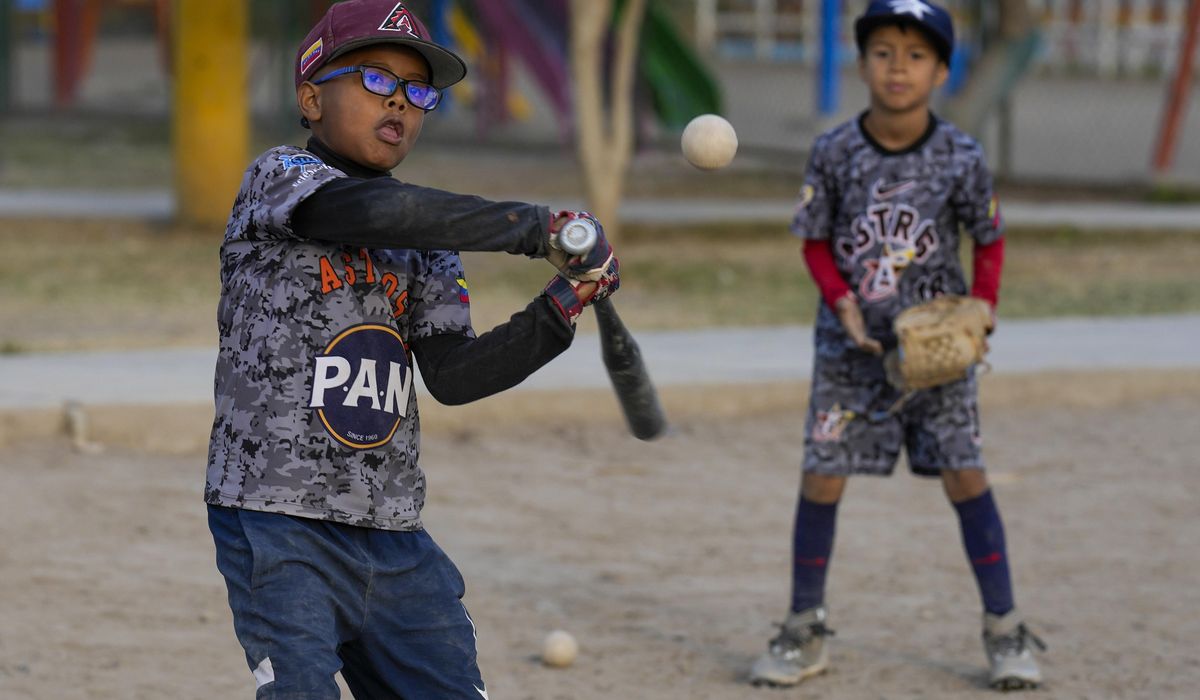 NextImg:Baseball becomes a shelter for Venezuelan children in soccer-mad Peru